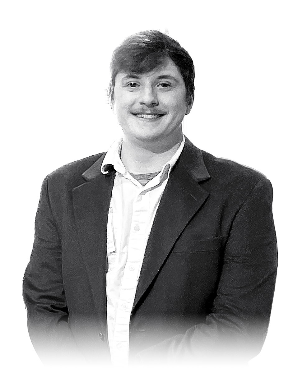 Charles Reister in collared shirt and suit jacket