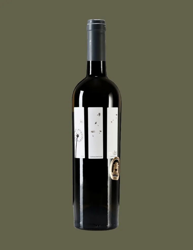 Dark wine bottle with a minimalist label featuring dandelion seeds blowing in the wind and a small gold award emblem.