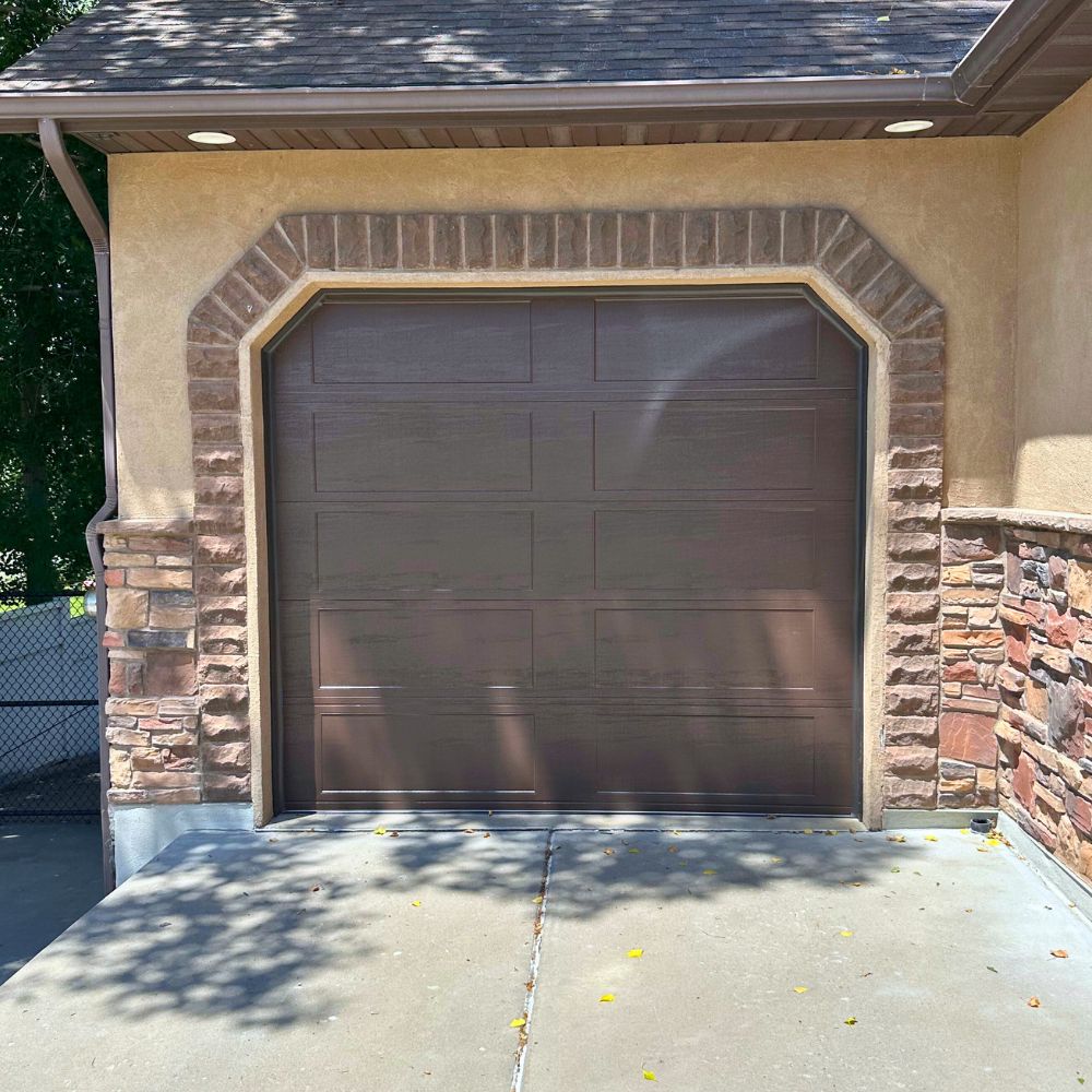 Brown arched garage door installation Morgan Utah