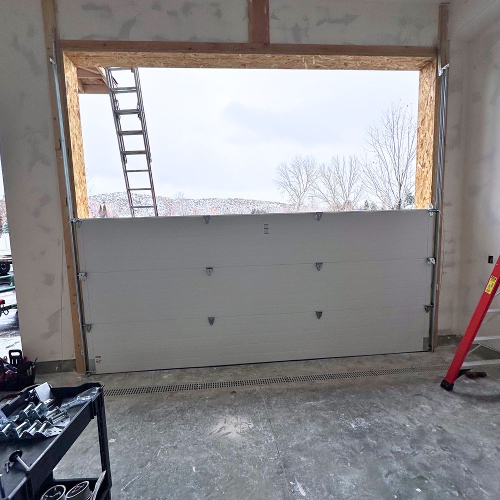 Garage door installation in progress Morgan Utah new construction Wilkinson Garage Doors