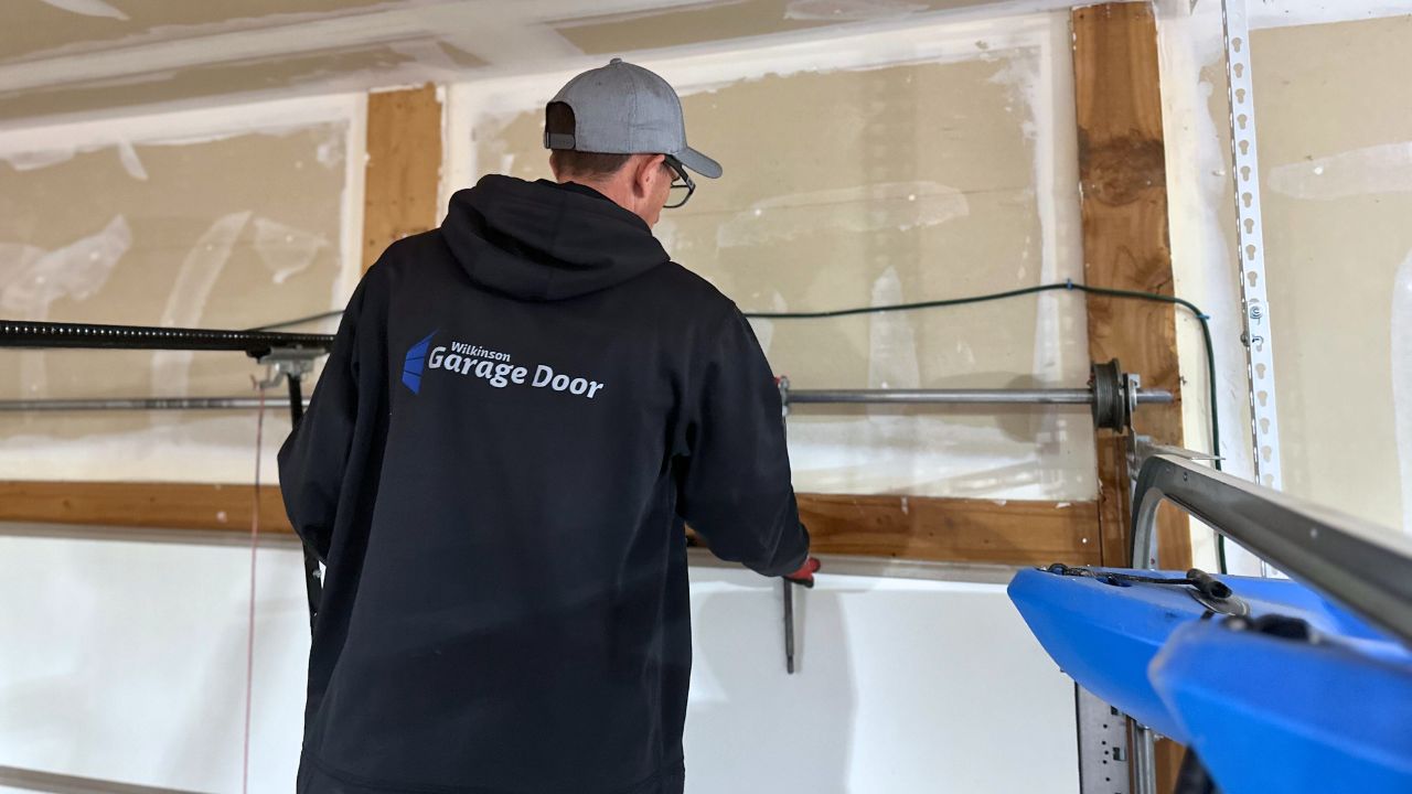 Wilkinson Garage Door technician repairing garage door Morgan County Utah