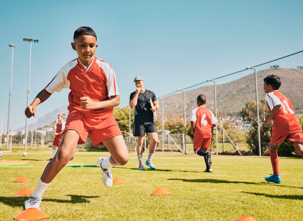 Kid playing soccer.