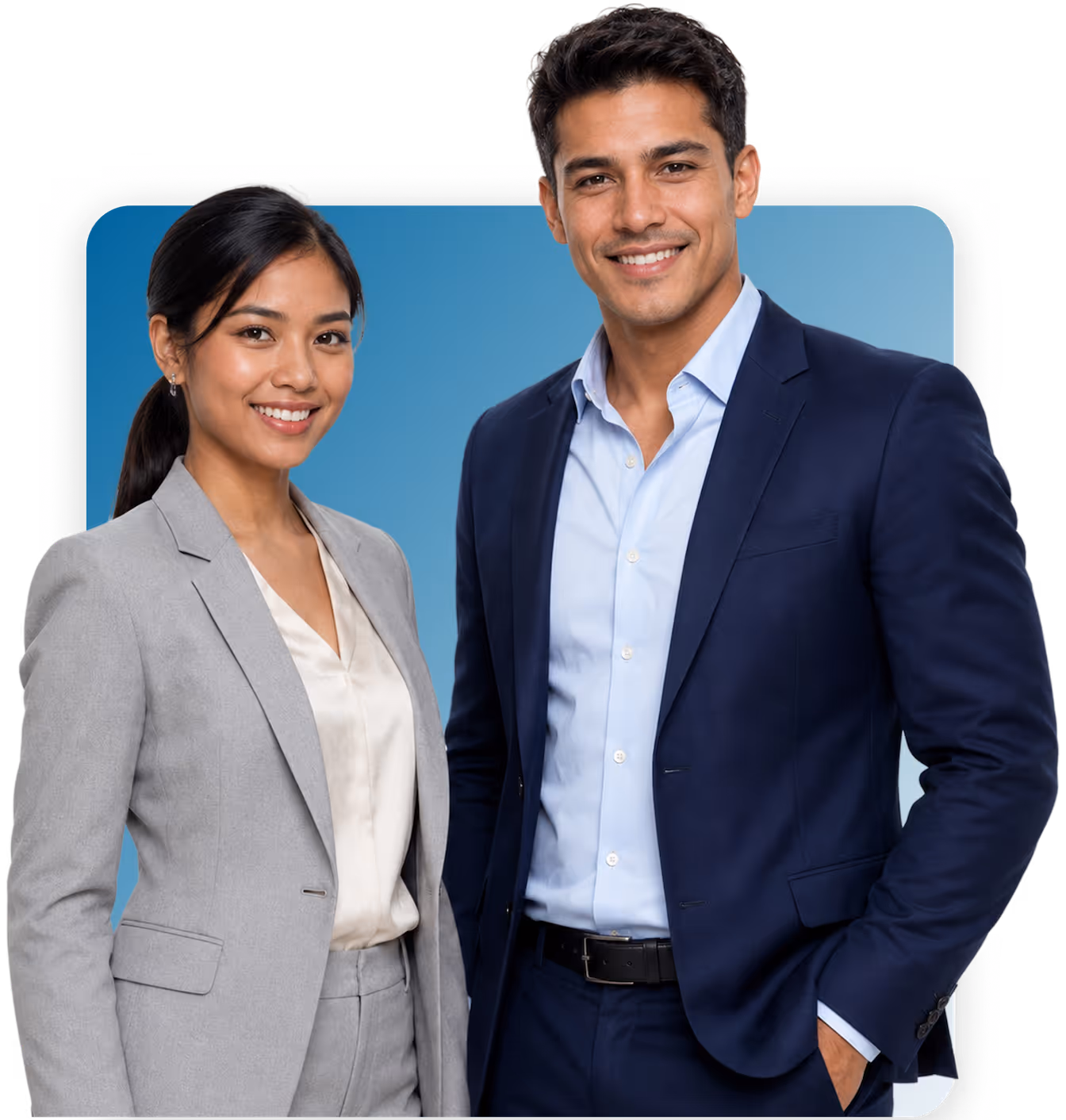 Smiling professional man in navy suit and woman in gray suit stand together against blue background.