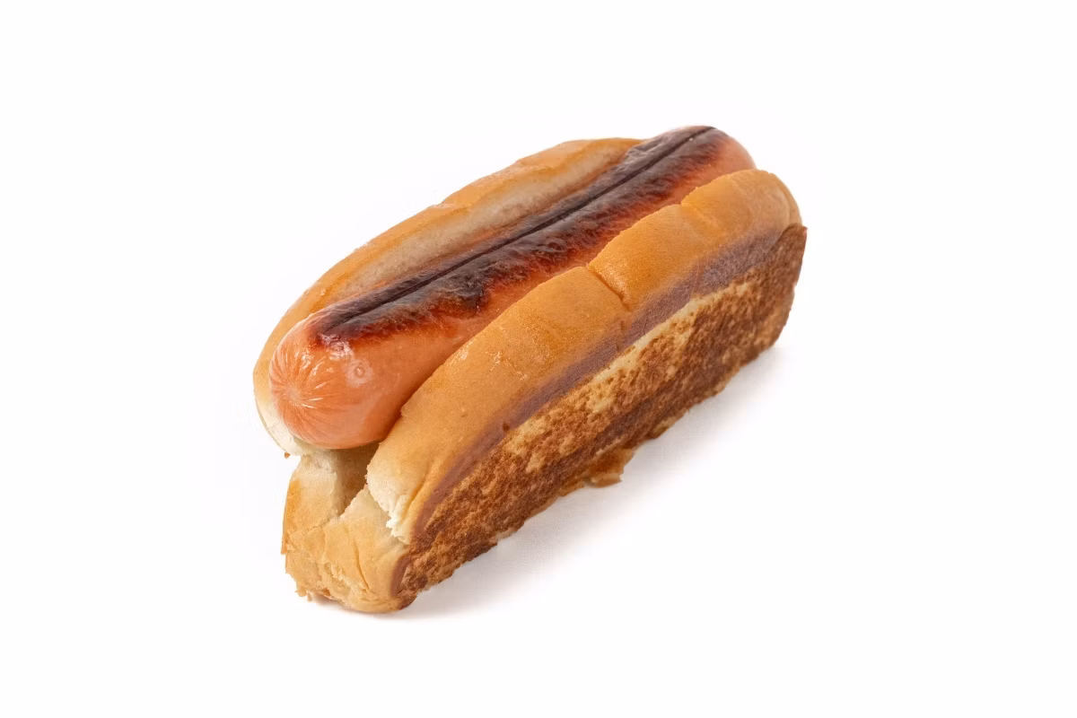 A grilled hot dog in a toasted bun, placed on a white background.