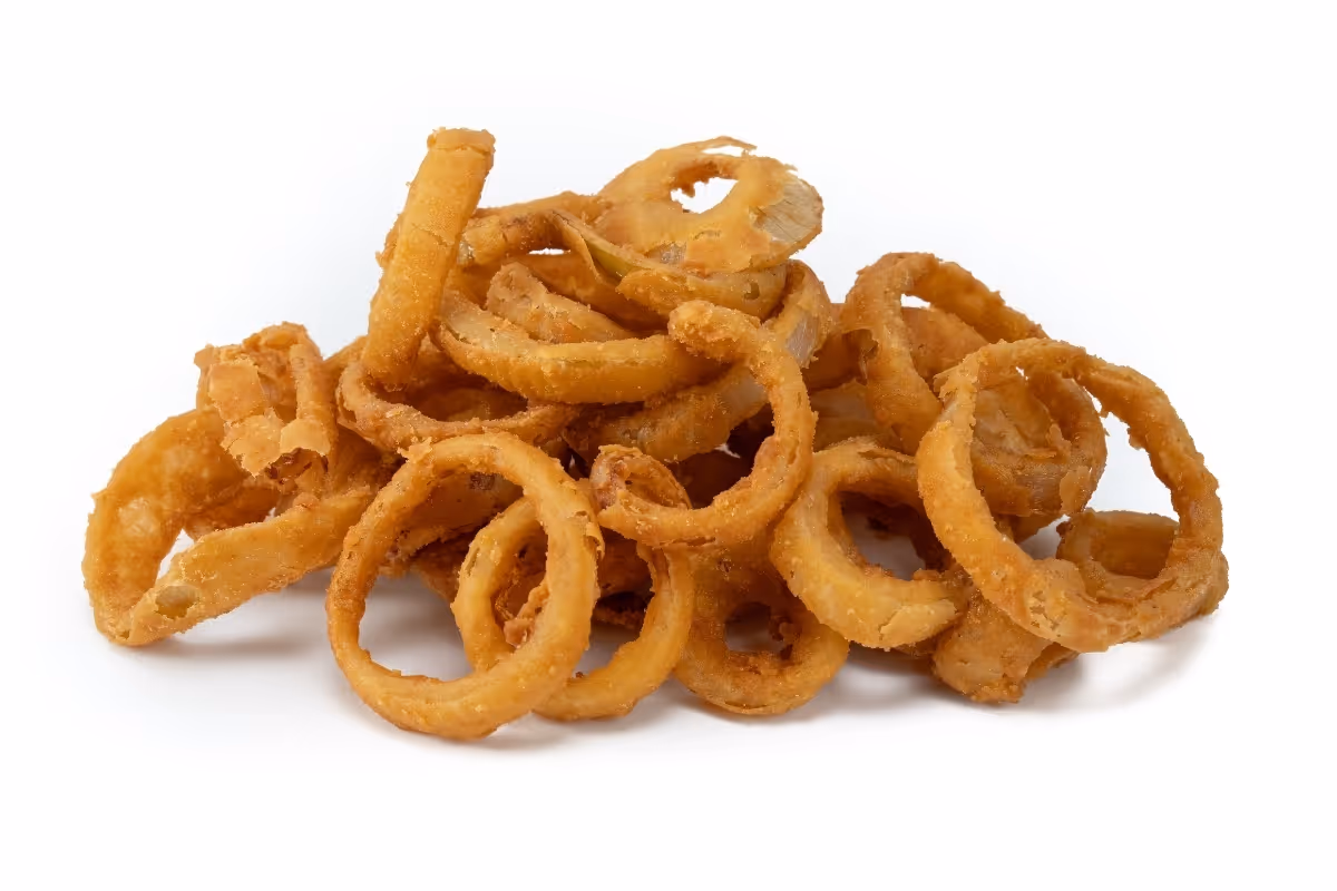 A pile of golden-brown fried onion rings on a white background.