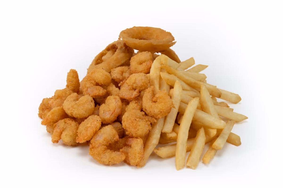 A pile of breaded fried shrimp, French fries, and onion rings on a white background.