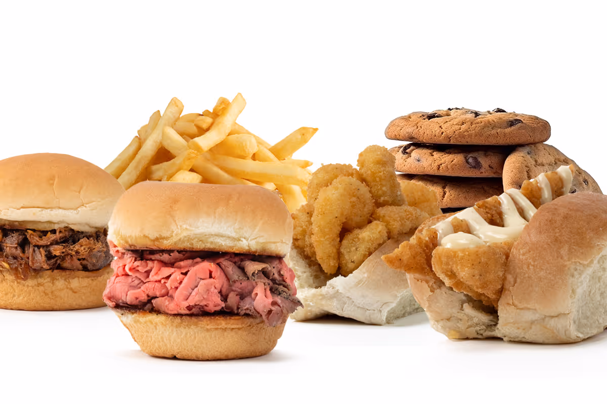 A variety of fast food items including sandwiches, French fries, and chocolate chip cookies.