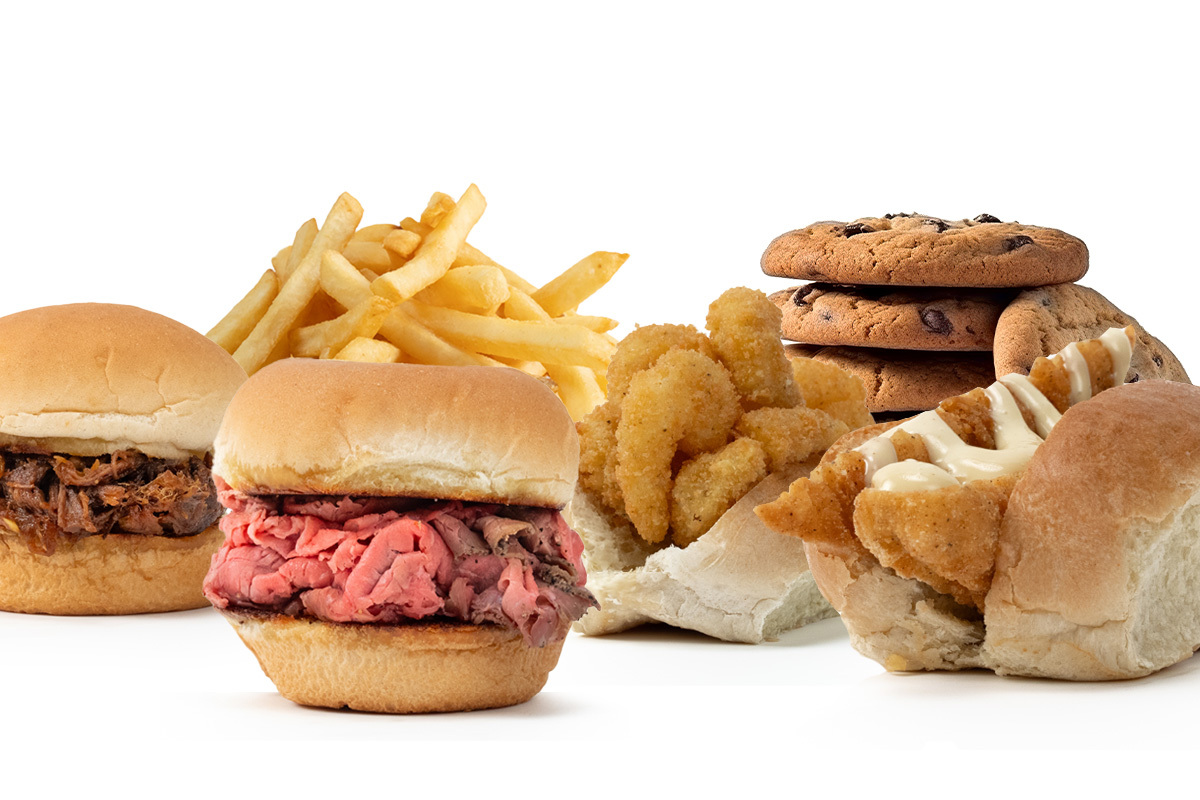 A variety of fast food items including sandwiches, French fries, and chocolate chip cookies.