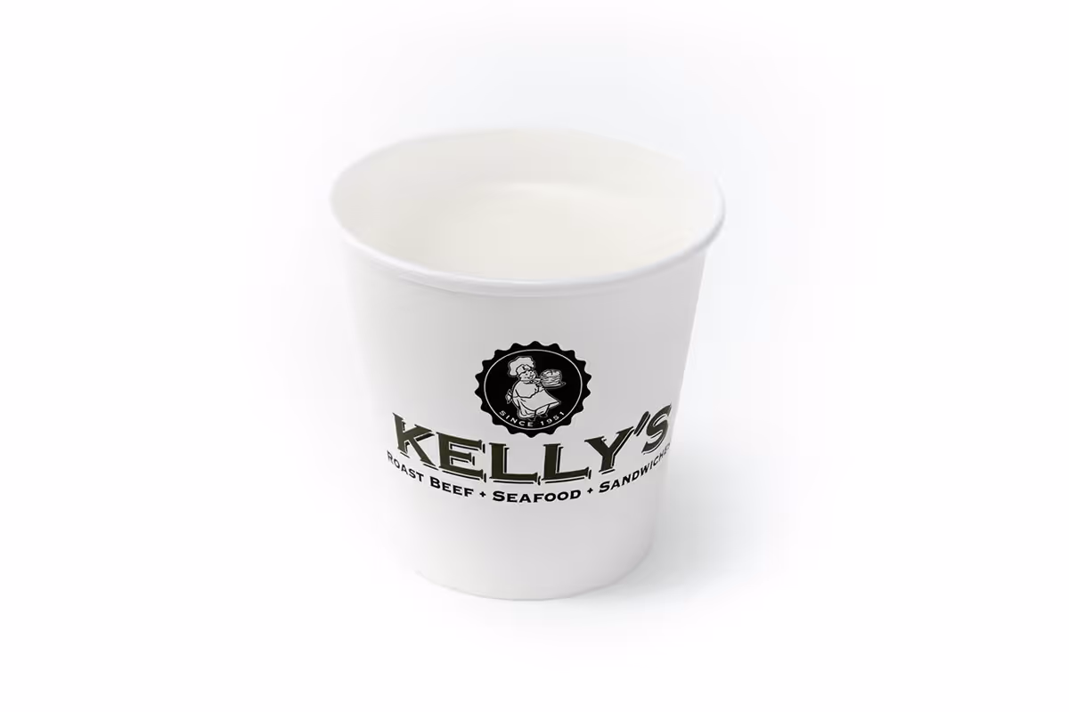 A white paper cup filled with water, featuring the Kelly’s logo and branding on the front.