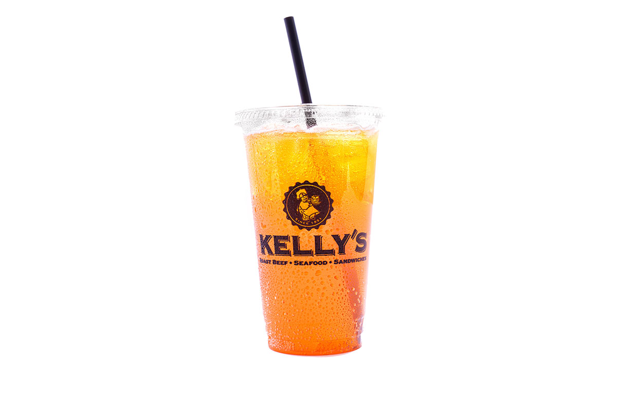 A plastic cup with orange beverage, ice, and a black straw, labeled "Kelly's" on a white background.