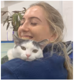 a vet nurse holding a cute cat
