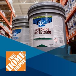 Buckets of PPG Speedhide Pro EV Zero white paint displayed in a hardware store aisle.