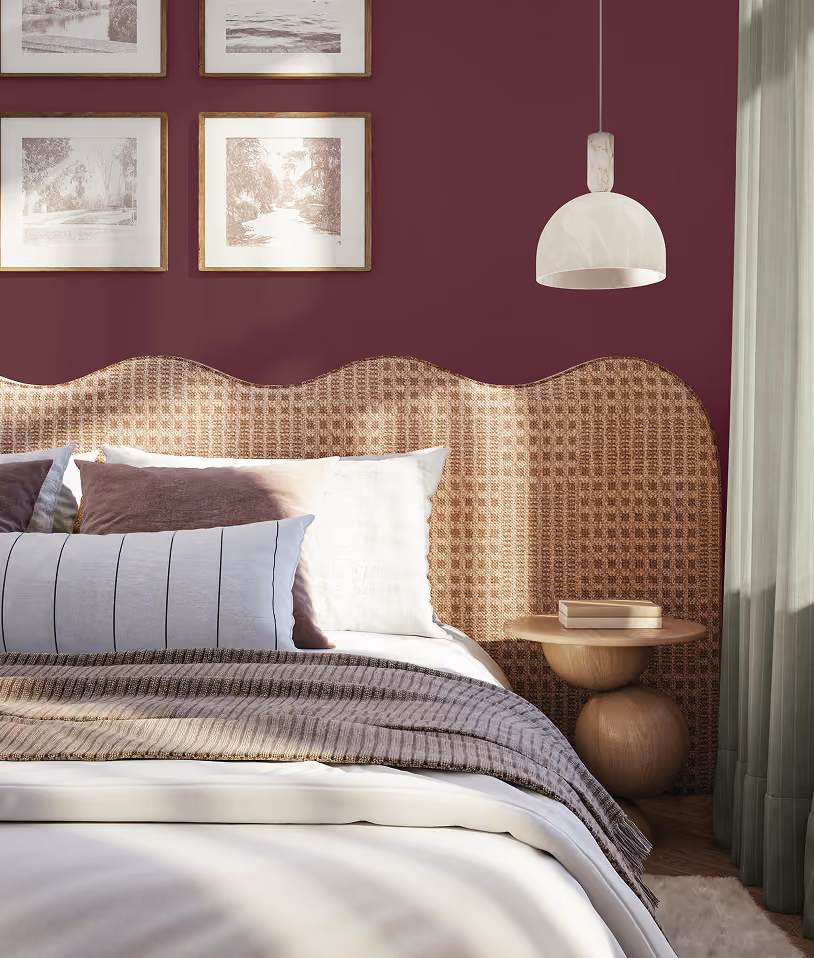 Burgundy accent wall in a modern bedroom interior