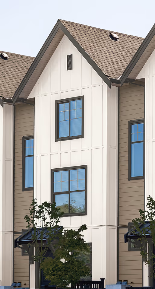 White and beige exterior siding on modern house