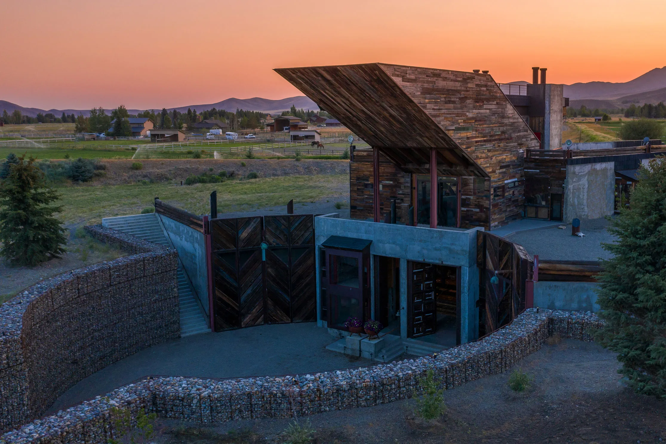 ‘30 Cheval’ in Bellevue, Idaho — sculptural elevation with board-formed concrete, wood, and louvered façade — Susan Desko