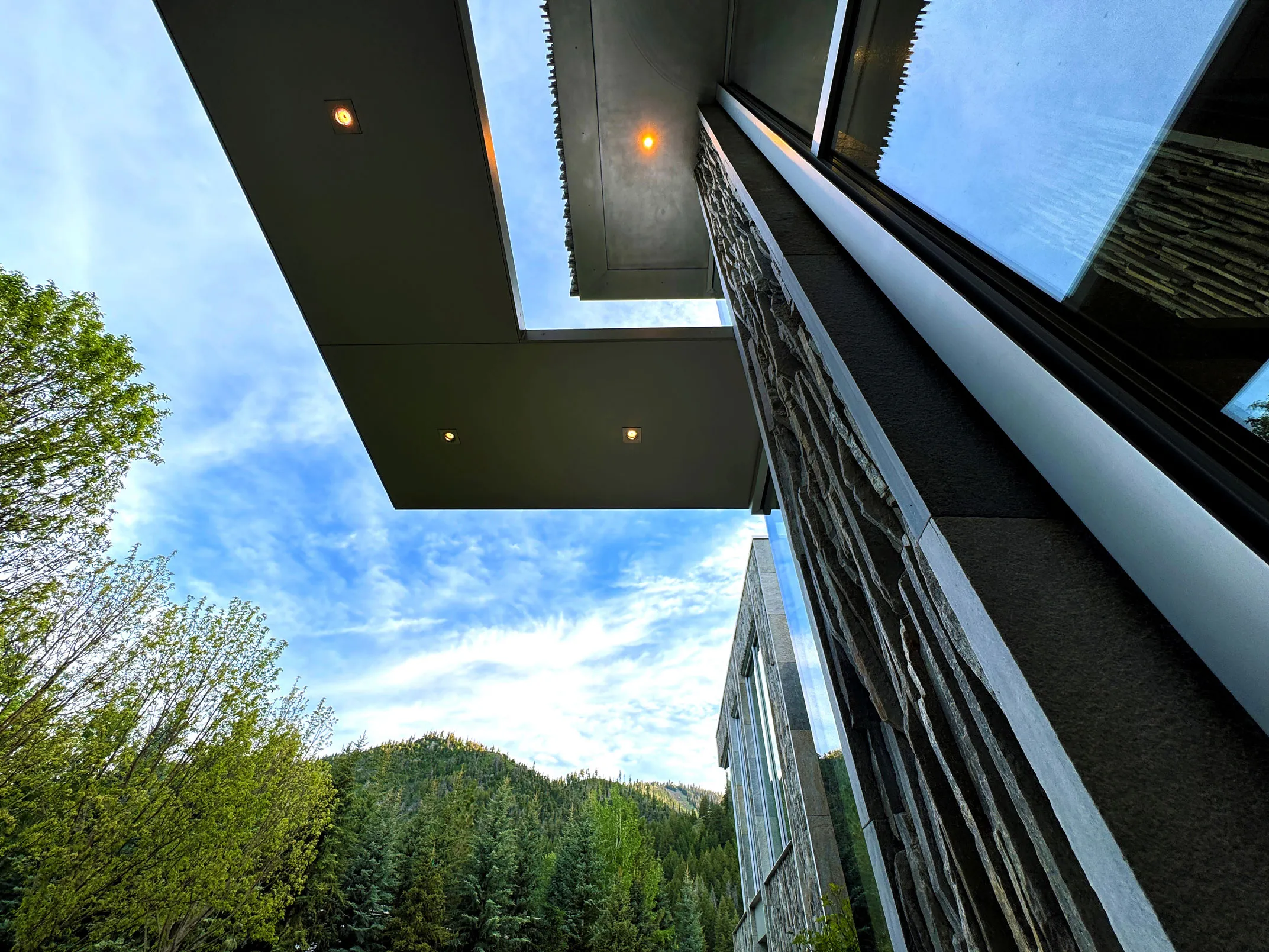 Cantilevered roof and stone facade, Goose Island residence — Susan Desko