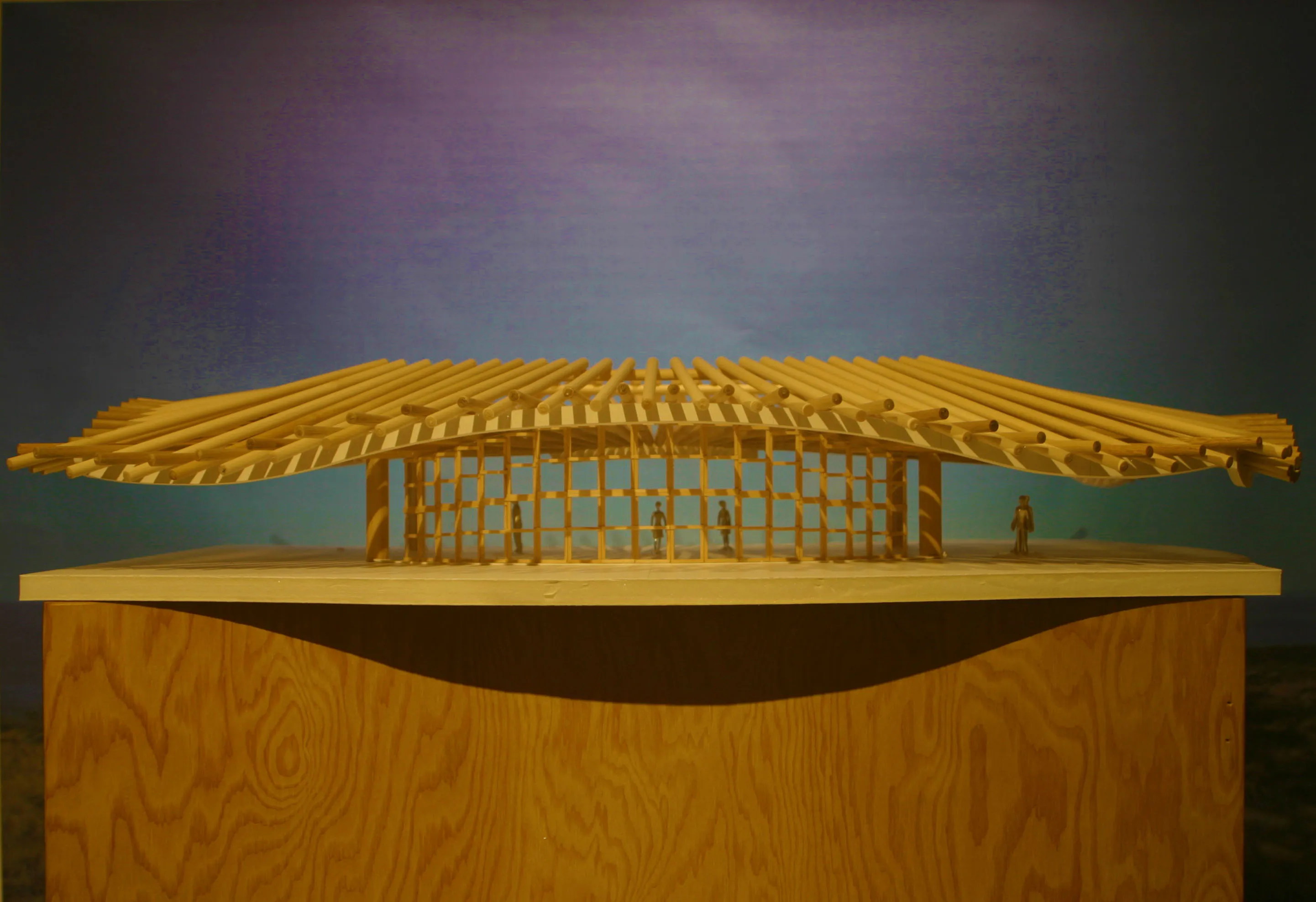 Architectural model with a dramatic wooden roof structure supported by a geometric frame, part of Susan Desko’s Kukio design project.