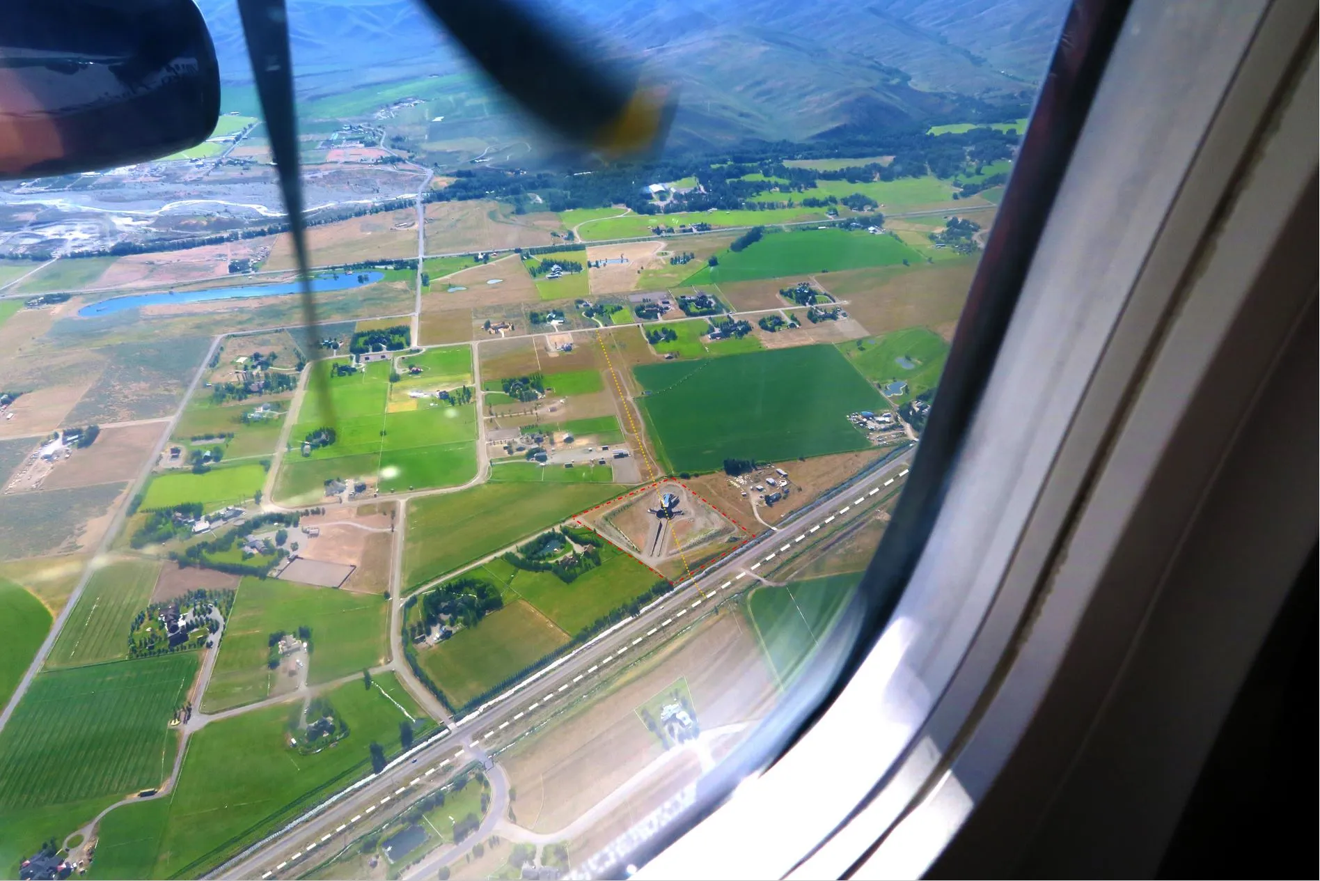 Photograph from airplane window overlooking the Bellevue Triangle development site in Idaho, designed by architect Susan Desko.