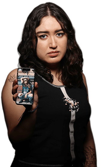 A young woman showing her phone with a picture of her friend on it