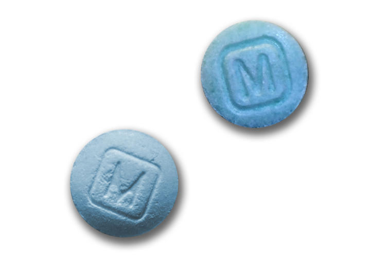 A graphic of a fake pill on the right and a real pill on the left