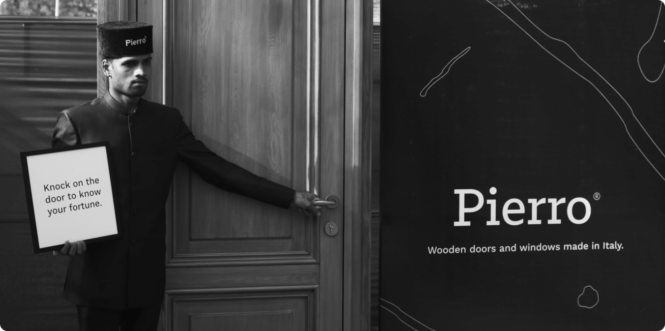Man holding pierro door with a sign
