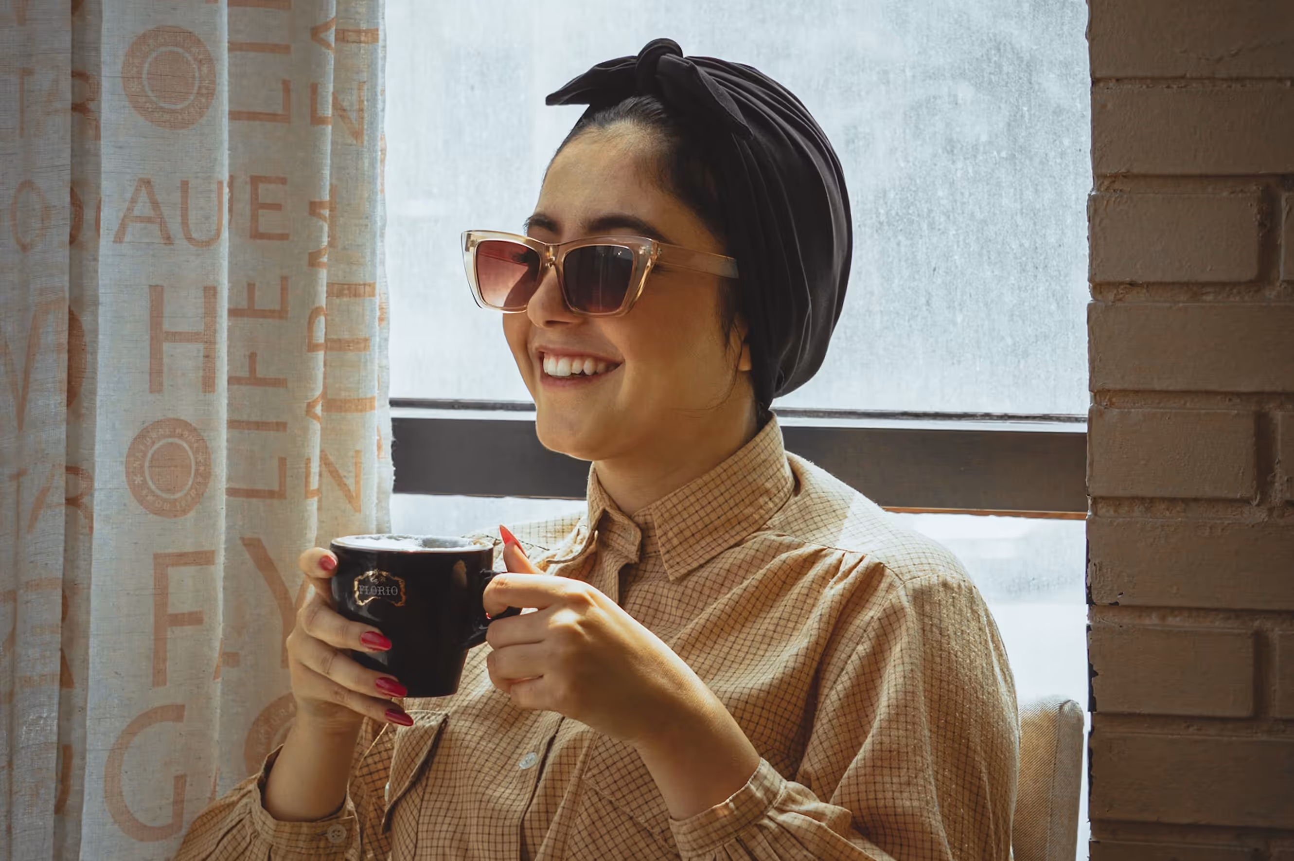 Team member relaxing and sipping coffee