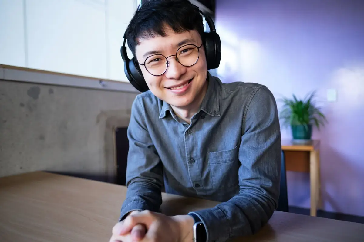 Atlas Digital senior strategist wearing headphones, ready for a client call