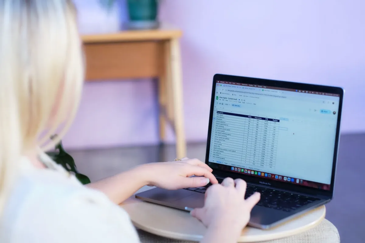 Atlas Digital paid strategist reviewing a target account list on a laptop