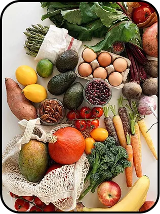 An illustration of healthy foods like vegetables, fruits, and eggs.