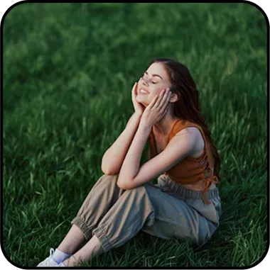 A girl enjoying wellness in the grass