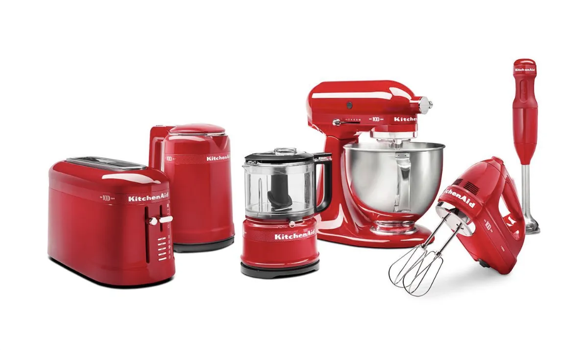 Red competitor kitchen appliances lined up for benchmarking