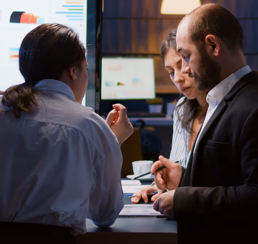 a group of people sitting at a table