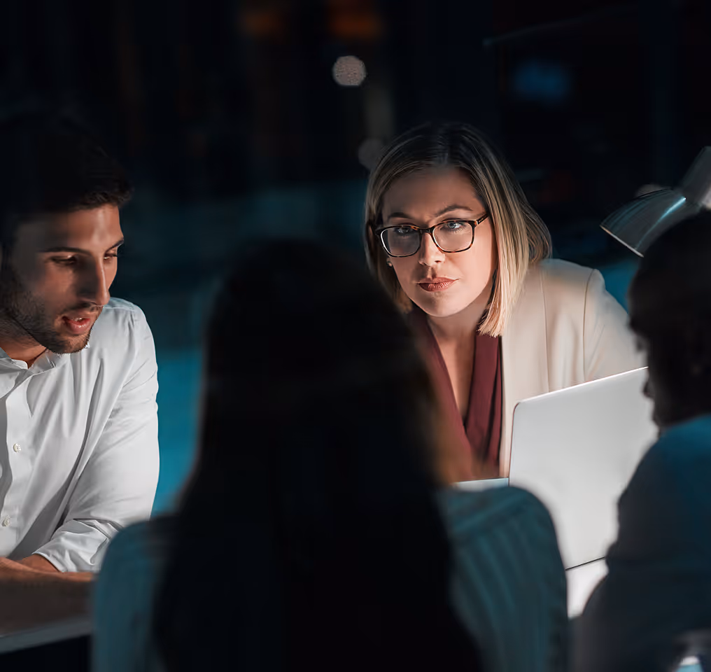 a group of people sitting around a table