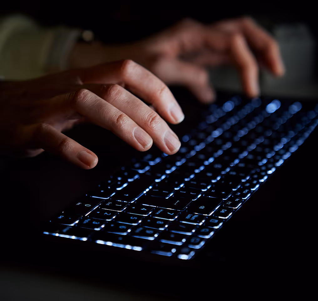 a person typing on a keyboard