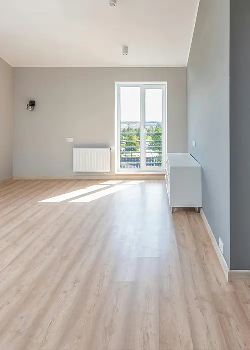 Light wooden flooring in a bedroom
