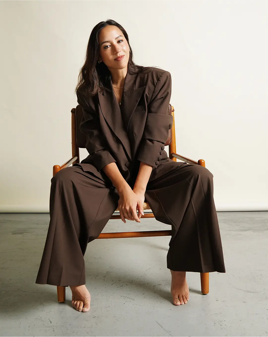 Sarah Larson Levey sitting on a chair posing