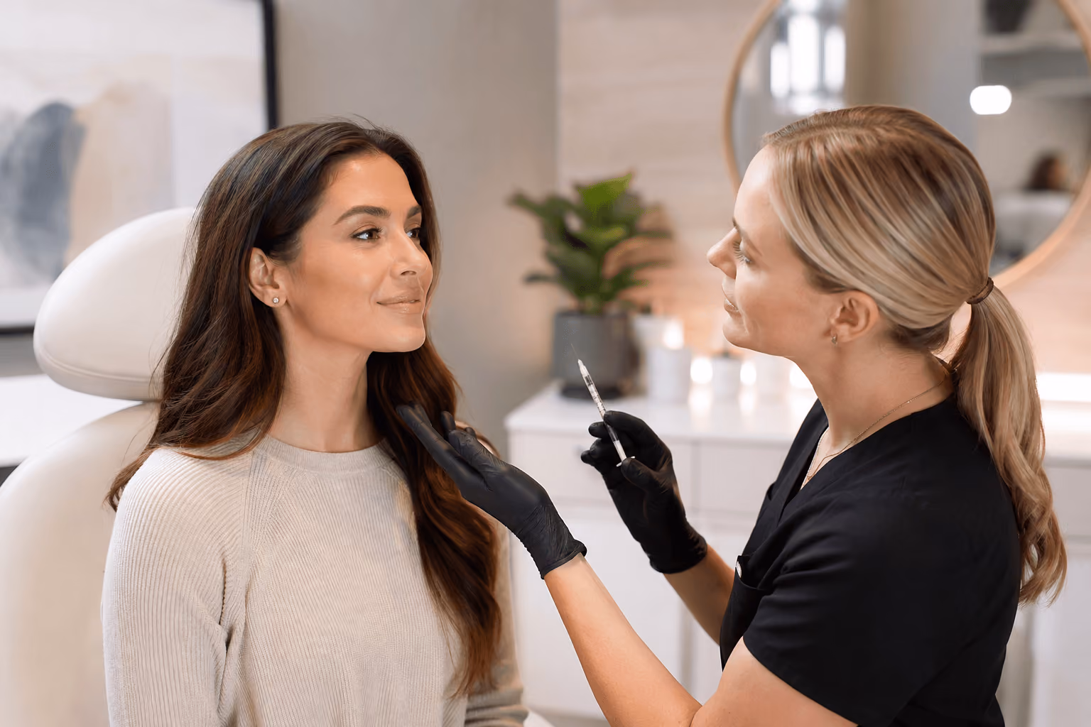 Woman consulting with a provider about Dysport treatment in Draper, Utah before receiving wrinkle-relaxing neurotoxin injections.