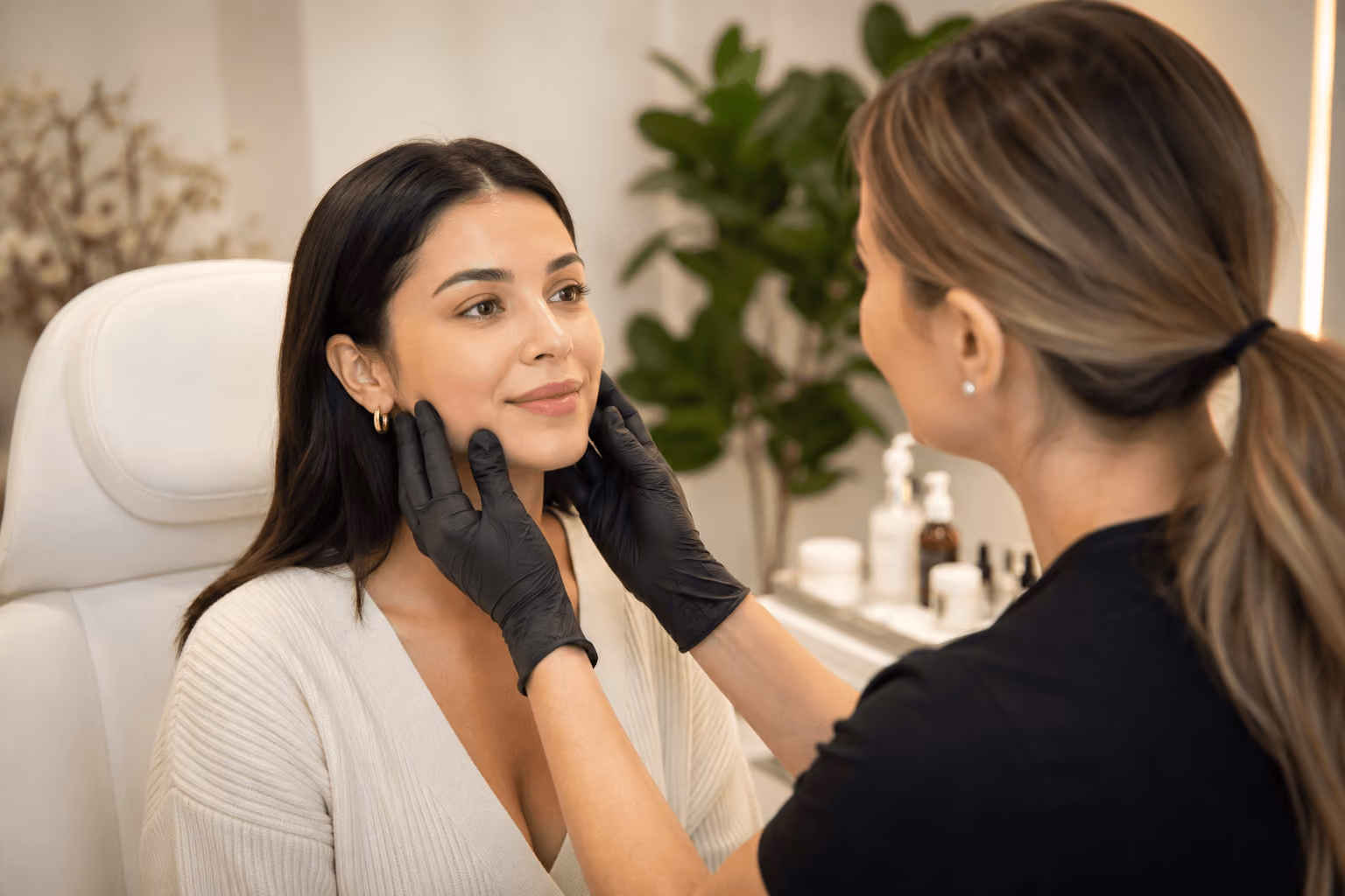 Provider consulting with a patient about dermal fillers and facial volume restoration in Draper, Utah.