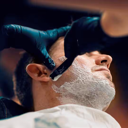 Picture of man getting his beard shaved