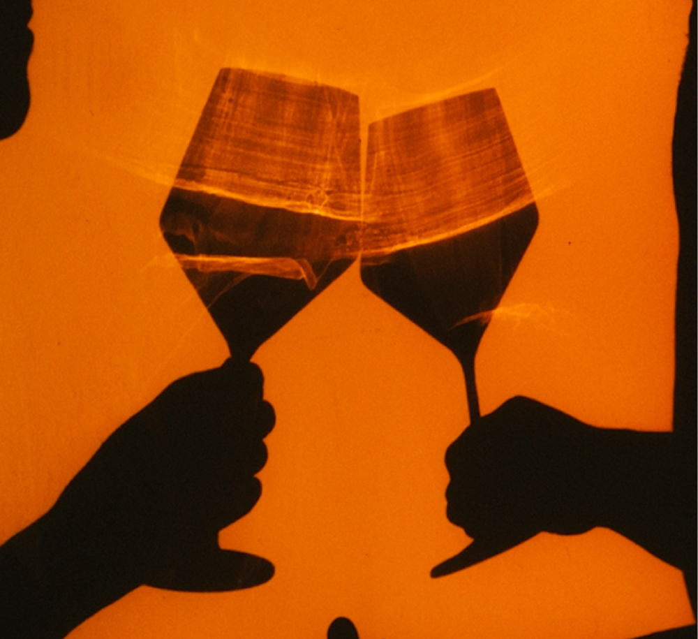 people toasting drinks silhouette