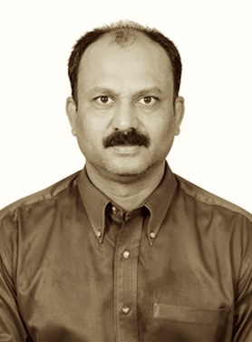 Portrait of Dr. E. Shaji Raj, Chief Physician carrying forward the 150-year Ayurvedic legacy with 33 years of service (1992–Present)