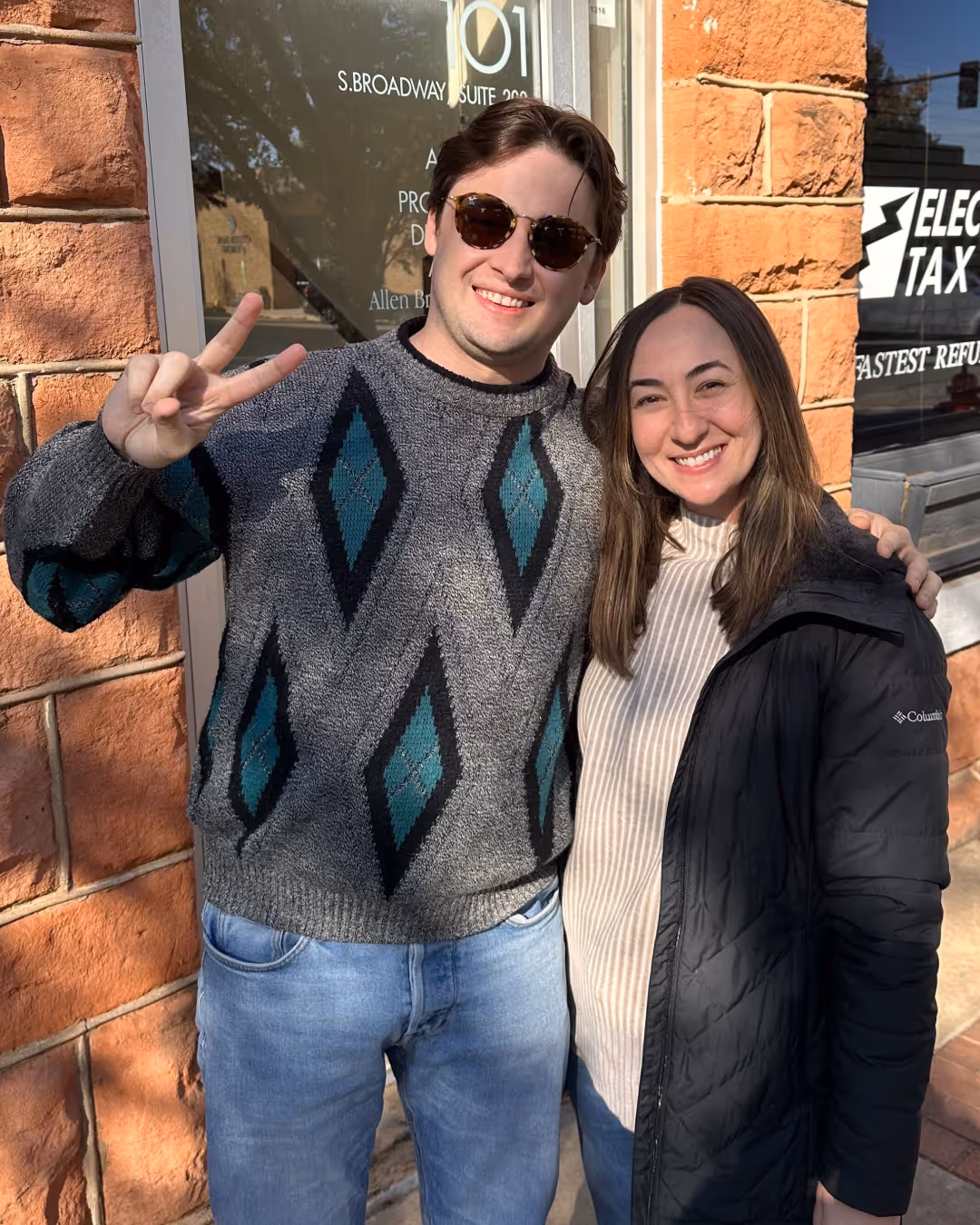 A man and a woman smiling 