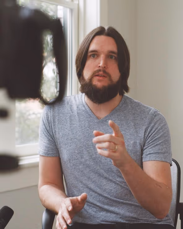 A man looking at a camera