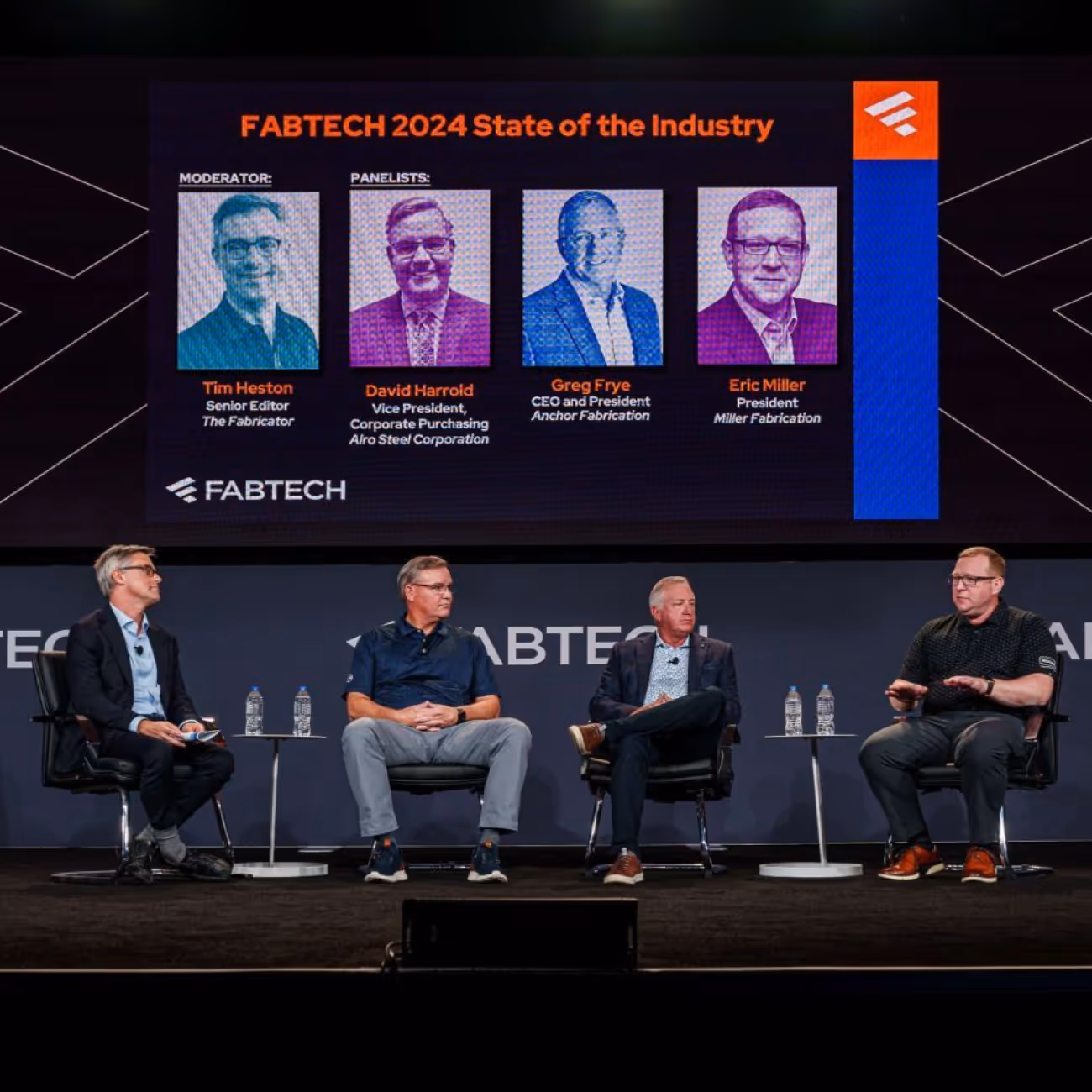 Panel discussion at FABTECH 2024 featuring moderator Tim Heston and panelists David Harrold, Greg Frye, and Eric Miller seated on stage with their names and titles displayed on a screen behind them.