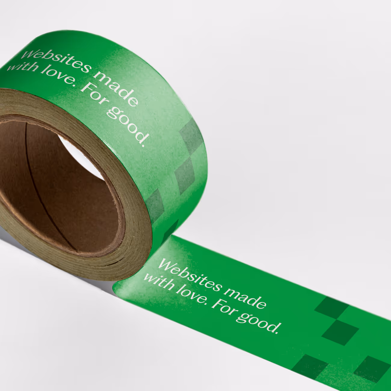Green adhesive tape with white text reading 'Websites made with love. For good.' on a white background.