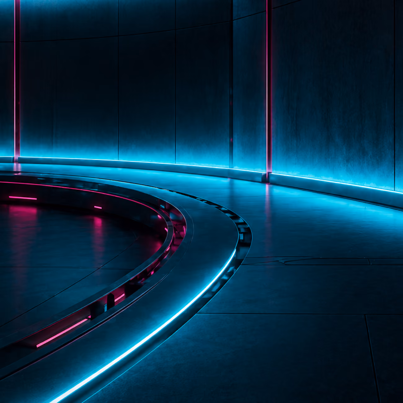 Curved futuristic hallway with blue and pink neon lighting along walls and floor edges.