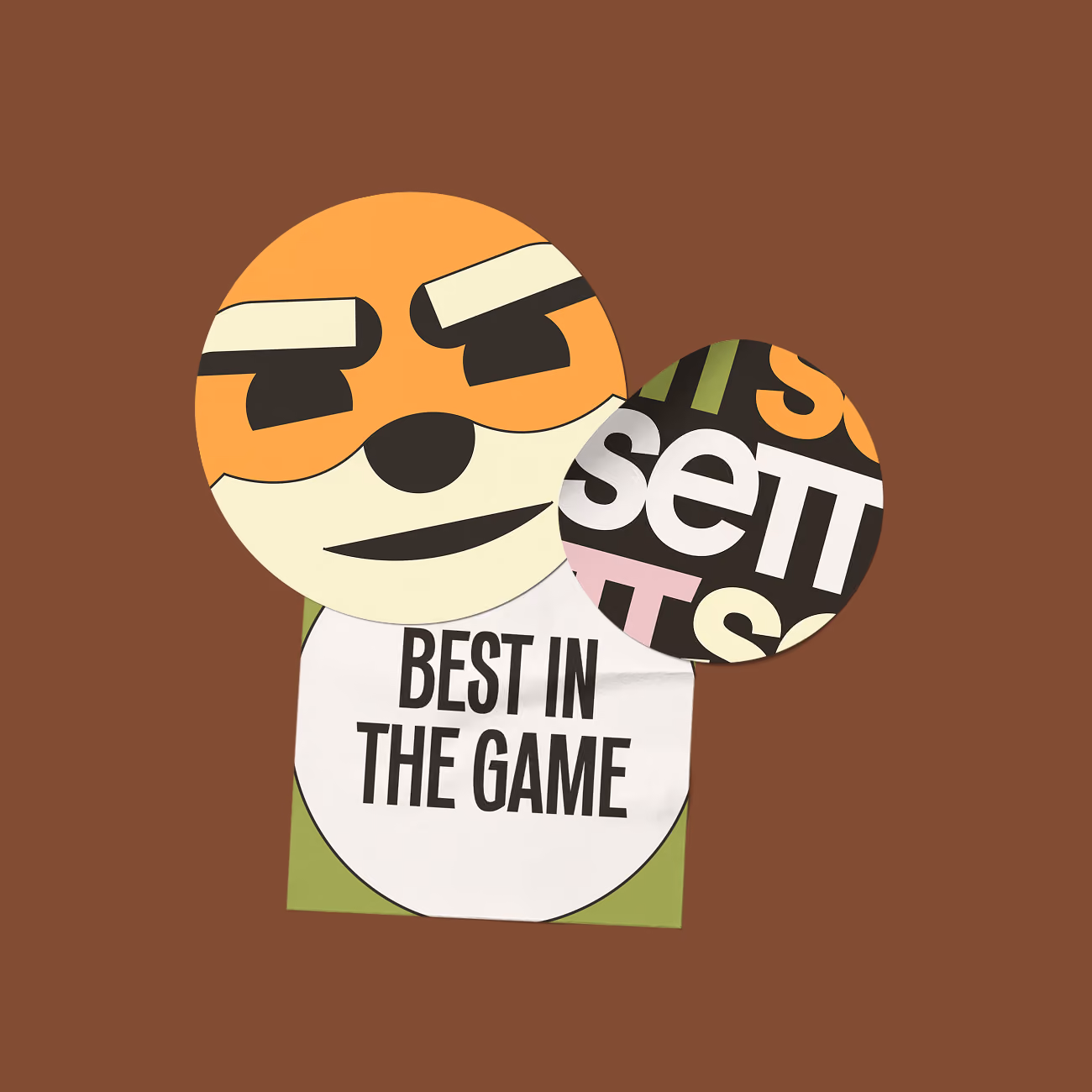 Sticker sheet with an orange meerket face and text sticker saying BEST IN THE GAME.