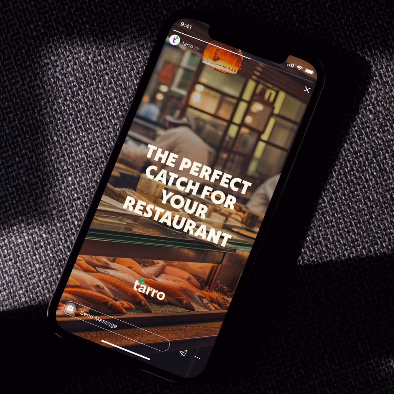 Smartphone showing a restaurant display with fish and the text: The perfect catch for your restaurant.