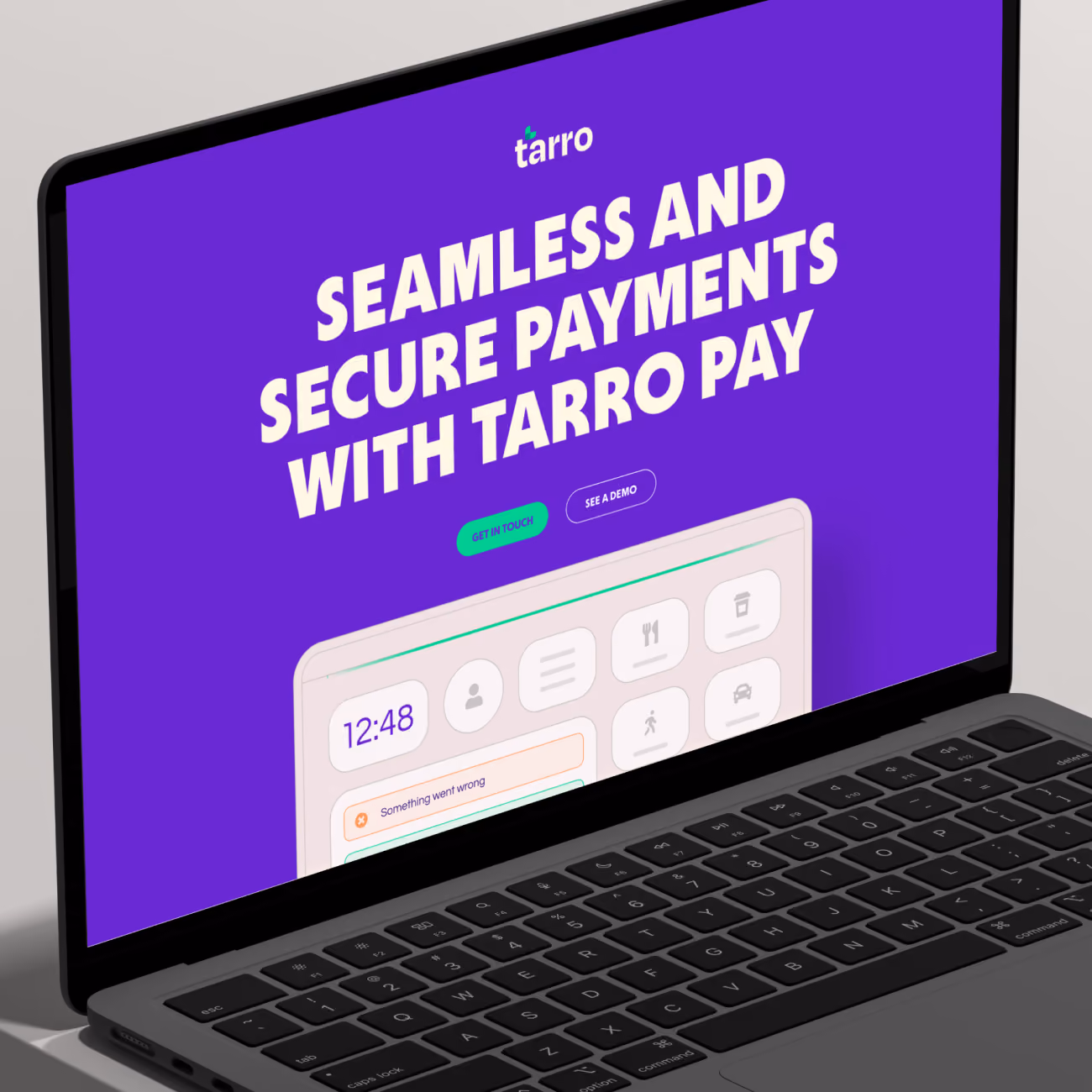Laptop screen showing Tarro website with headline about seamless and secure payments and demo buttons.
