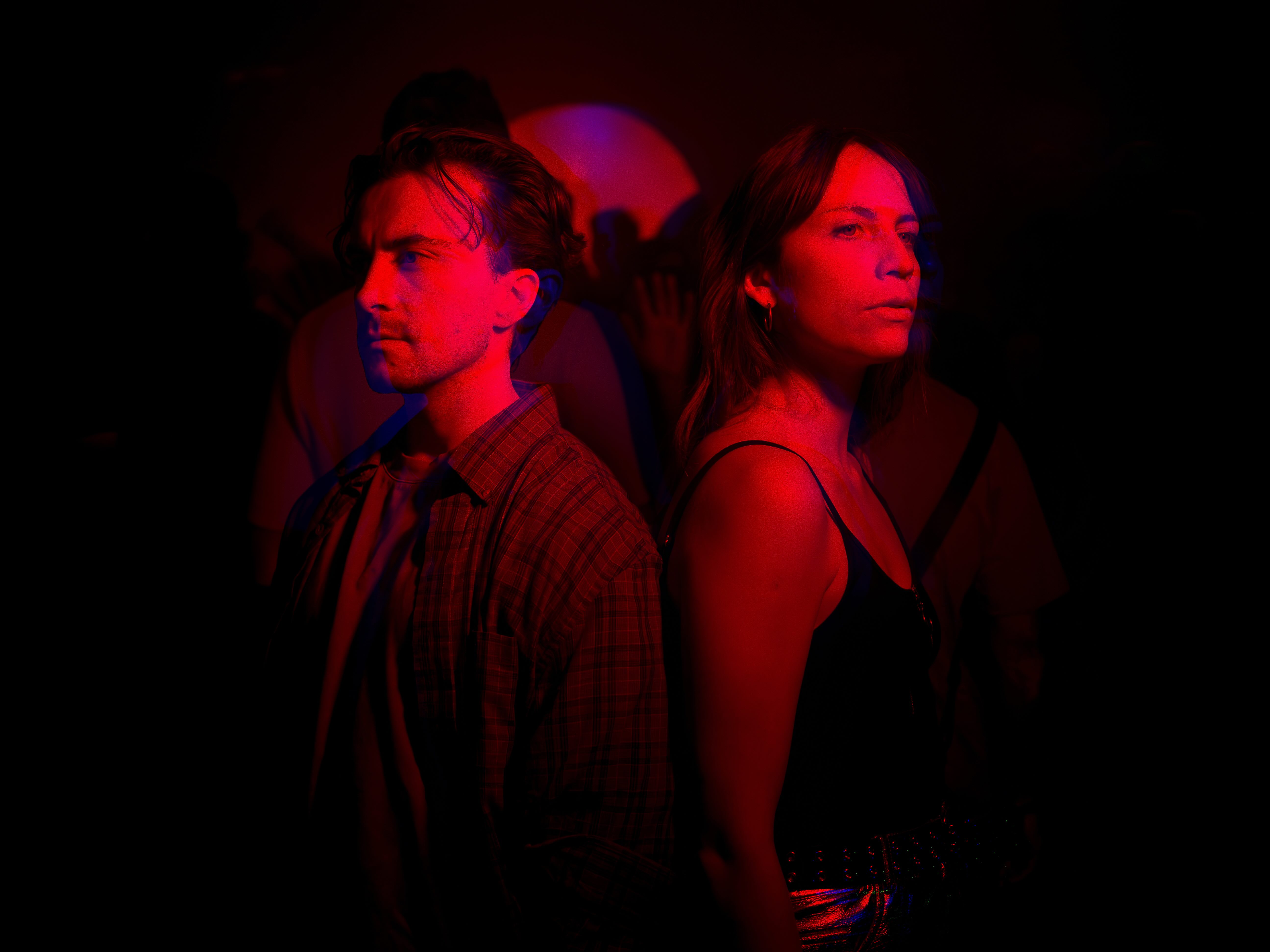 music producer adjusting sound levels on a console